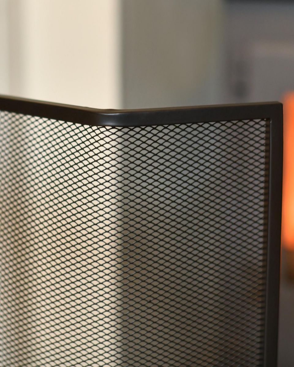 Close Up Of Black Contemporary Curved Fire Guard with Handle Top Frame