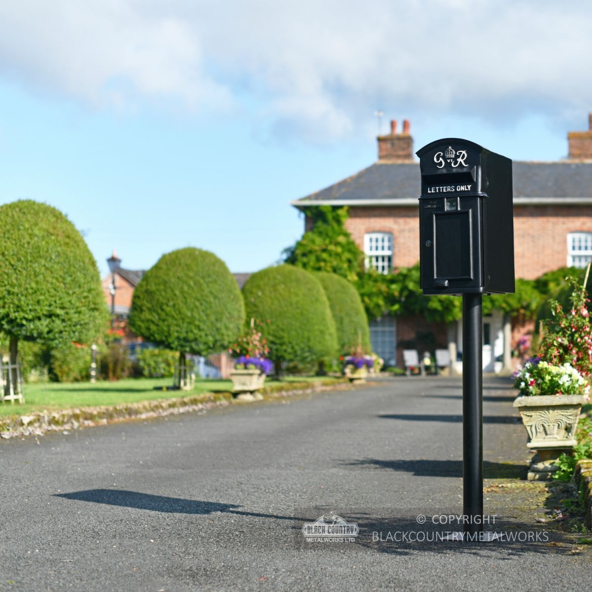 Black Curved Top GR Post Box & Stand Installed On Driveway