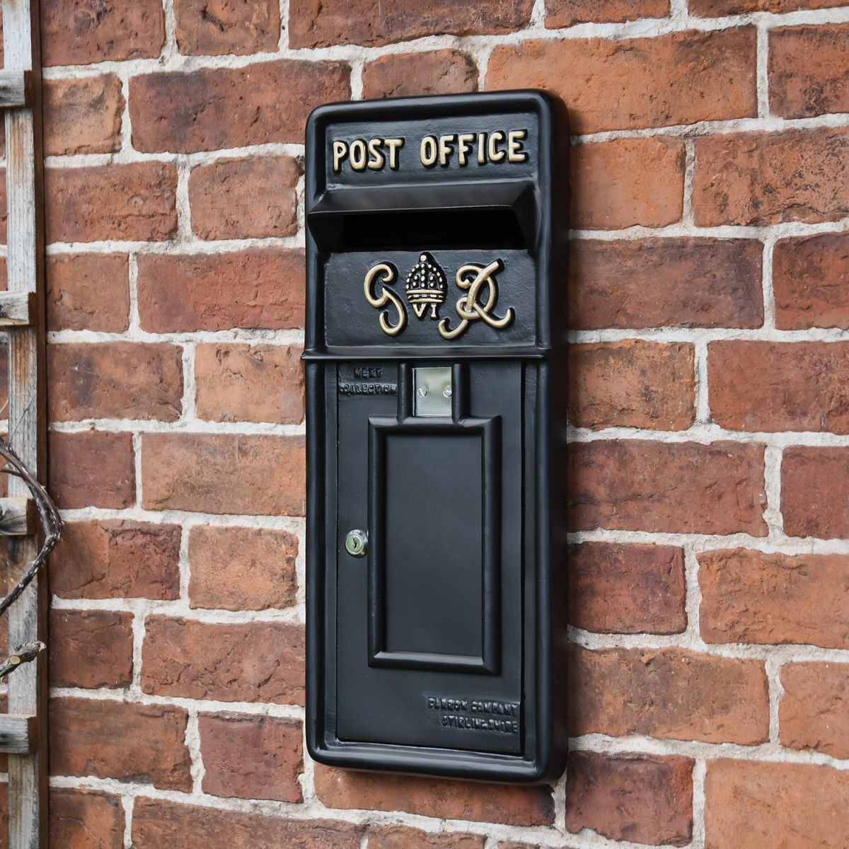 Black "King George" Rex Post Box Front in Situ on a Brick Wall