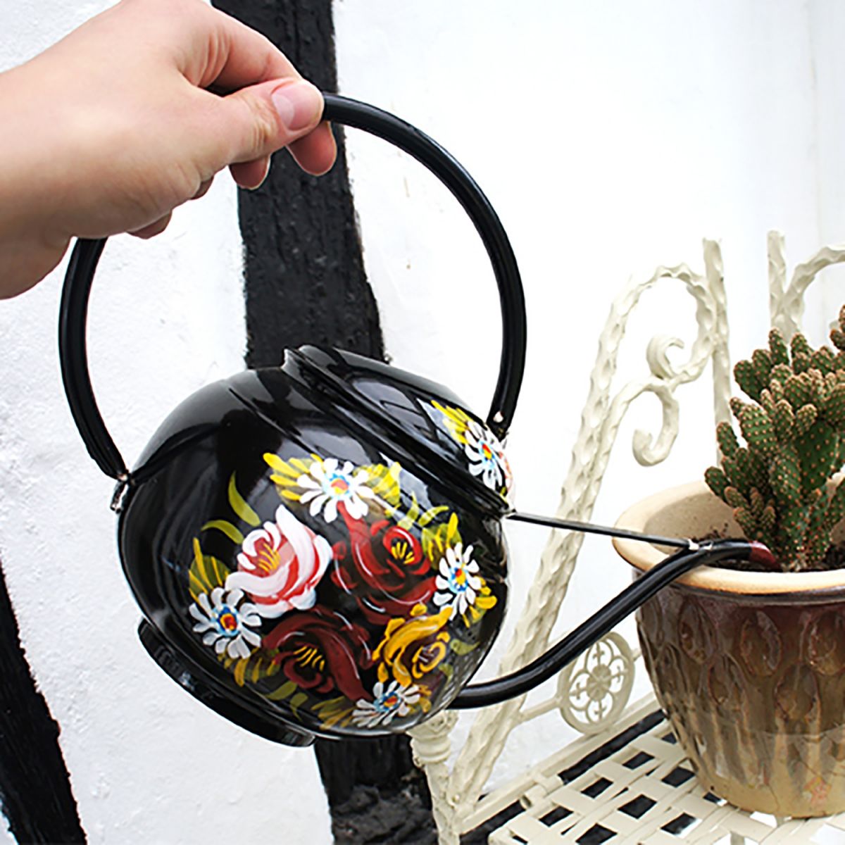 Black Narrowboat Watering Can in Use in the Garden