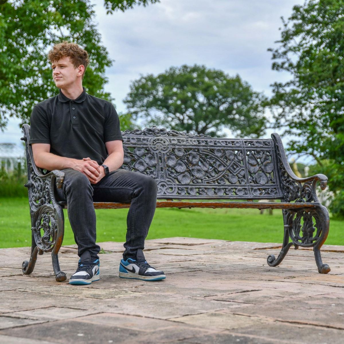 Aged Black Cast Iron Leaf Scroll Bench with Male for Scale