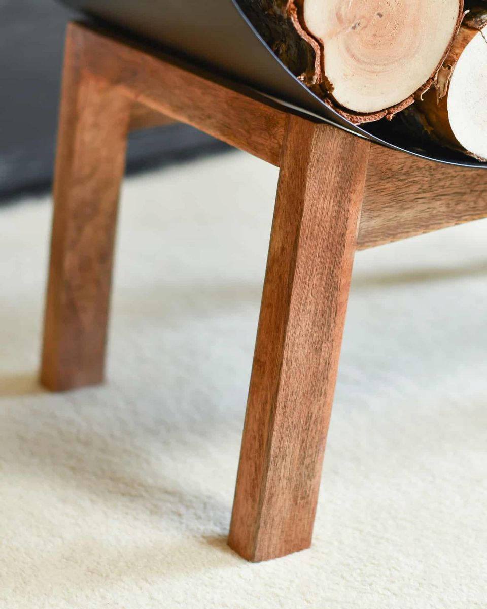 Close-Up of Wooden Legs for Black Round Steel "Barrel" Log Holder