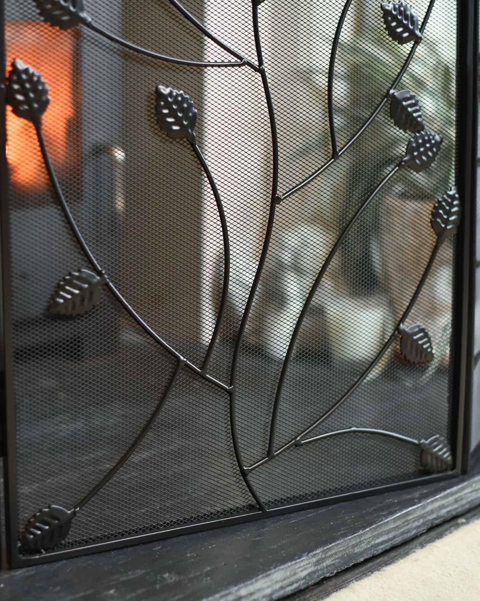 Close-Up of Black Three Fold Fire Guard with Leaf Detailing - 100cm