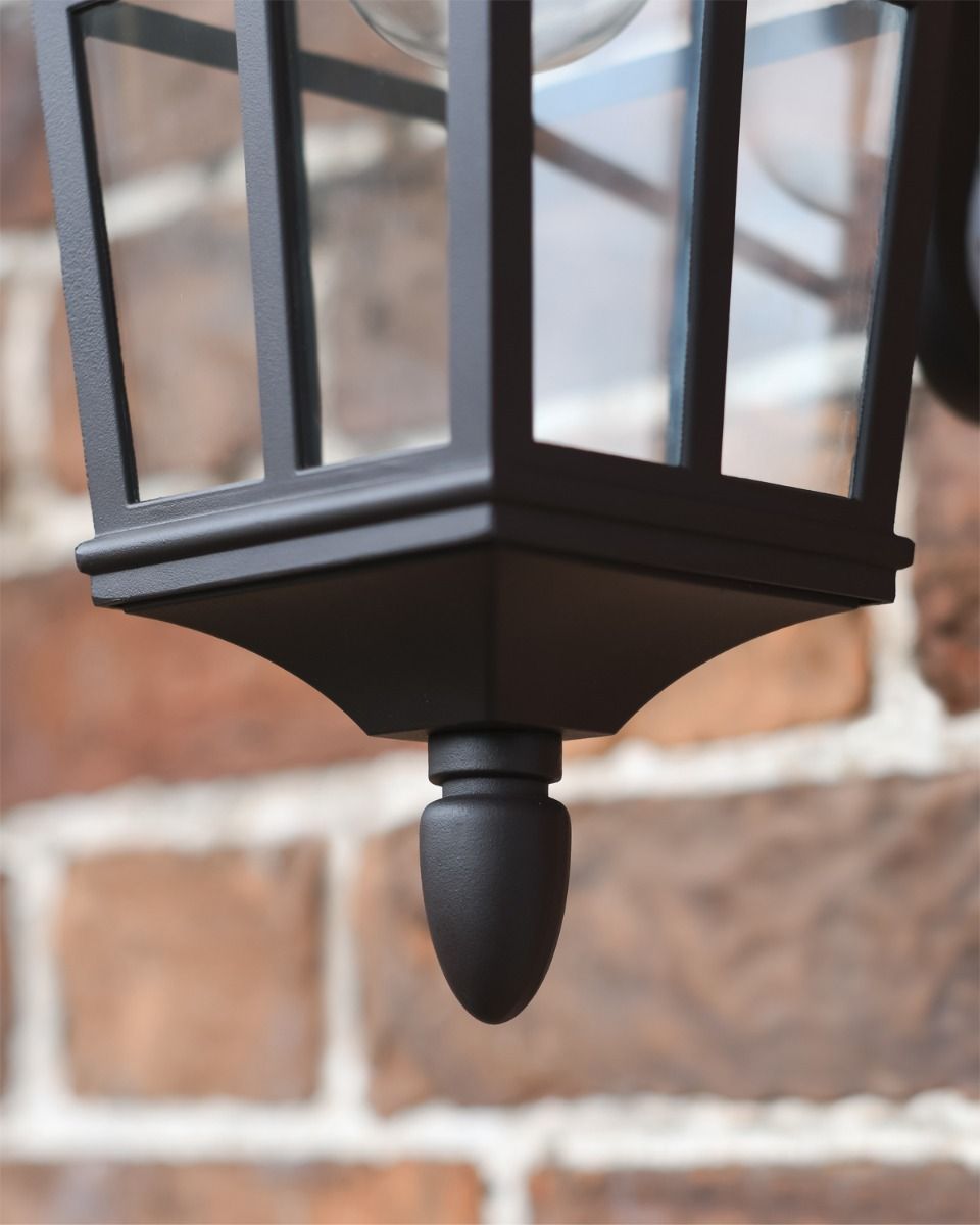 Close Up of Bottom Finial and Paned Glass in Wall Lantern 