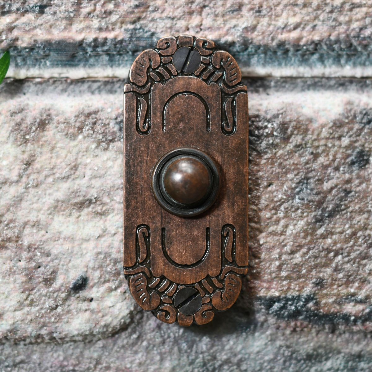 Burnished copper Bell Push on Brick wall