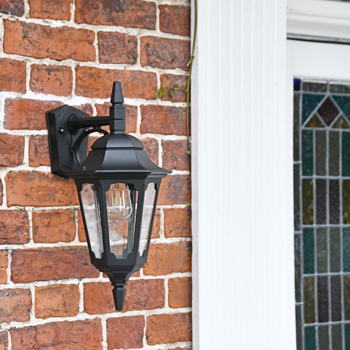 Bridlington Large Top Fix Black Wall Lantern in Use by the Front Door
