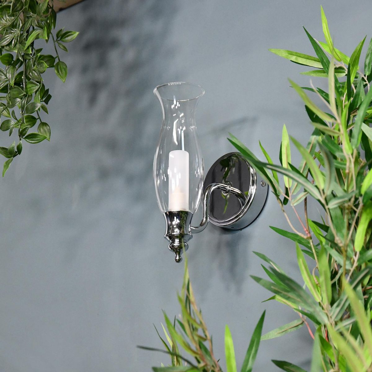 Old Style Gas Lamp Bathroom Wall Light Next to Plants in the Bathroom