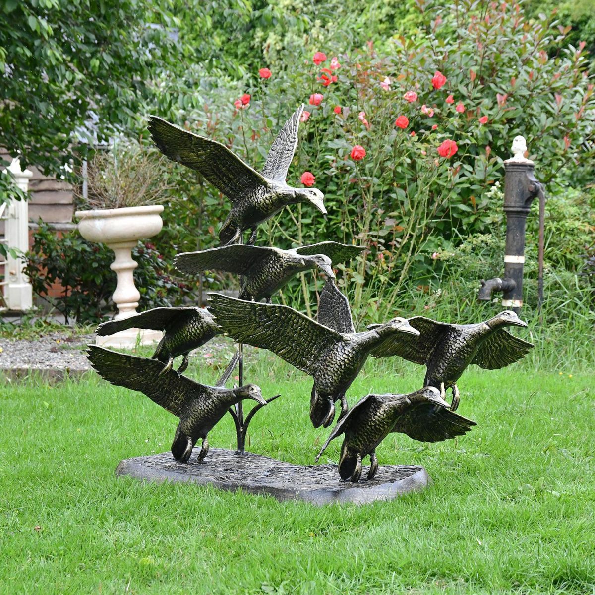 Bronze Finish Flying Duck Sculpture in Situ in the Garden