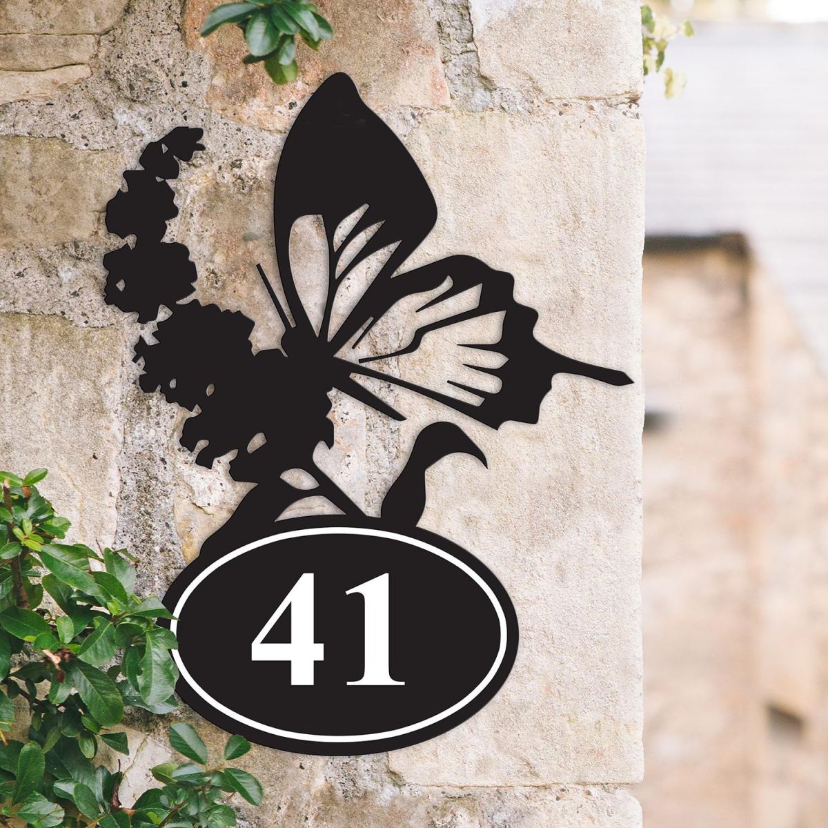 Bespoke Butterfly Iron House Number Sign on a Garden Wall