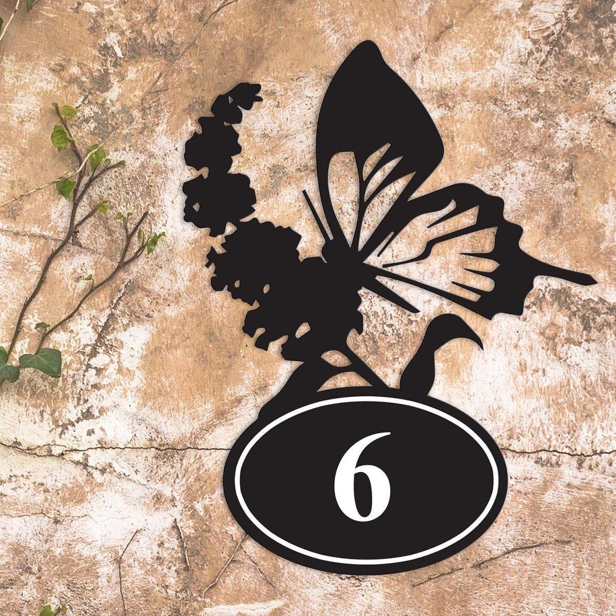 Butterfly Iron House Number Sign in Situ on a Rustic Wall 