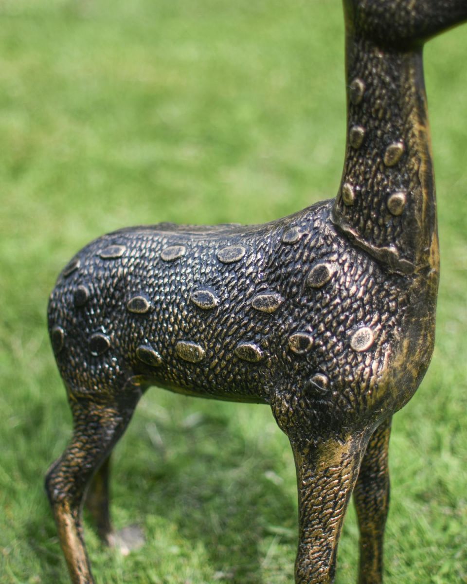 Close-Up of Lifelike Spotted Coat on Doe Sculpture