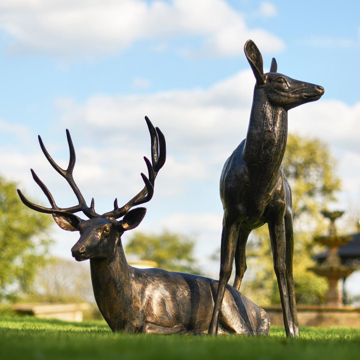 Cast Aluminium Standing Doe and Sitting Stag Sculptures in Situ