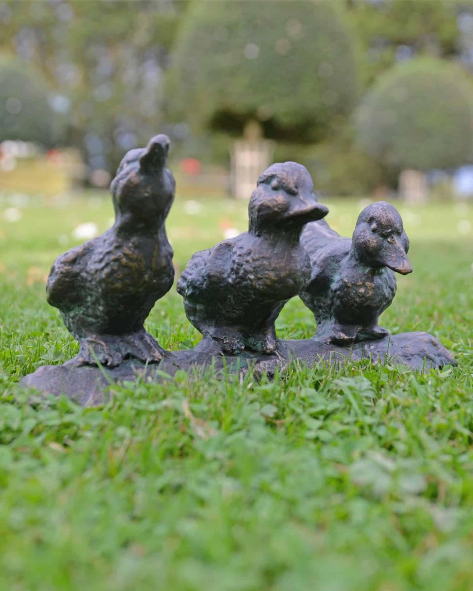 Cast Iron "Dynamic" Duck Family Trio Sculpture in Place in the Garden