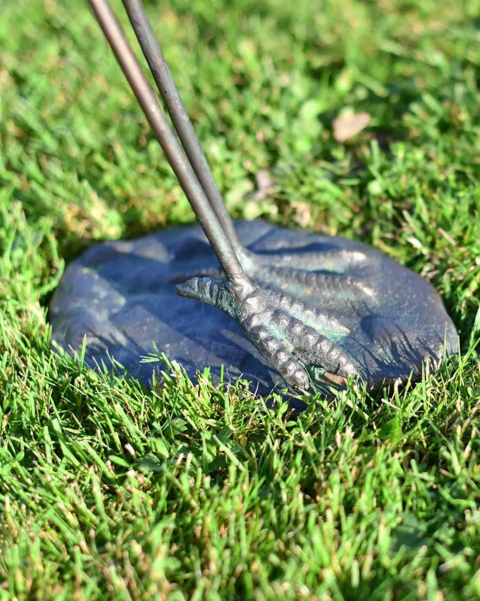 Close-Up of Freestanding Base onFreestanding Flamingo Sculpture with Head Down