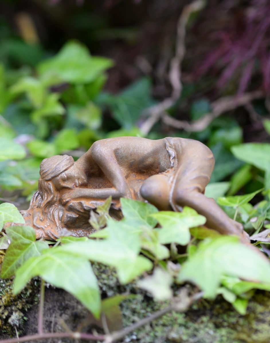 Serene Cast Iron Sleeping Woman Sculpture