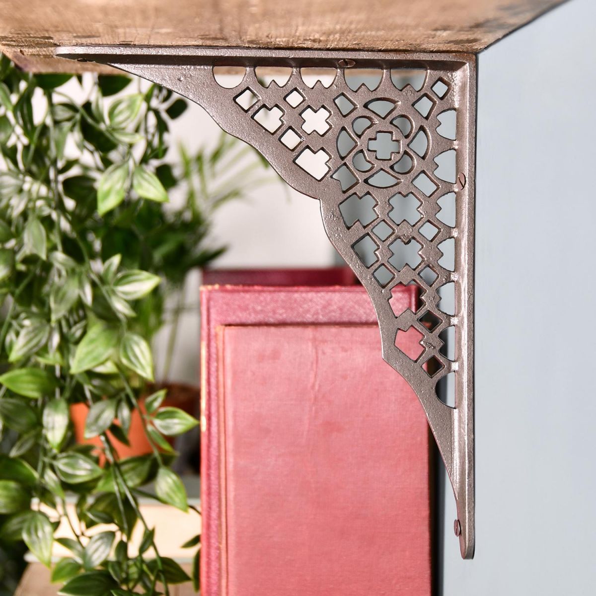 View From the Side of the Cast Iron Trellis Patterned Shelf Bracket Holding up a Wooden Shelf