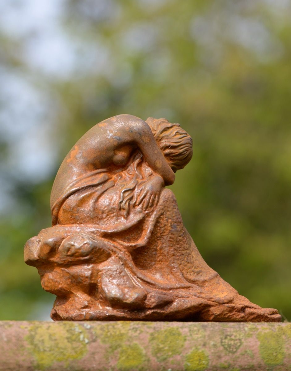 Back of Cast Iron Resting Woman Sculpture