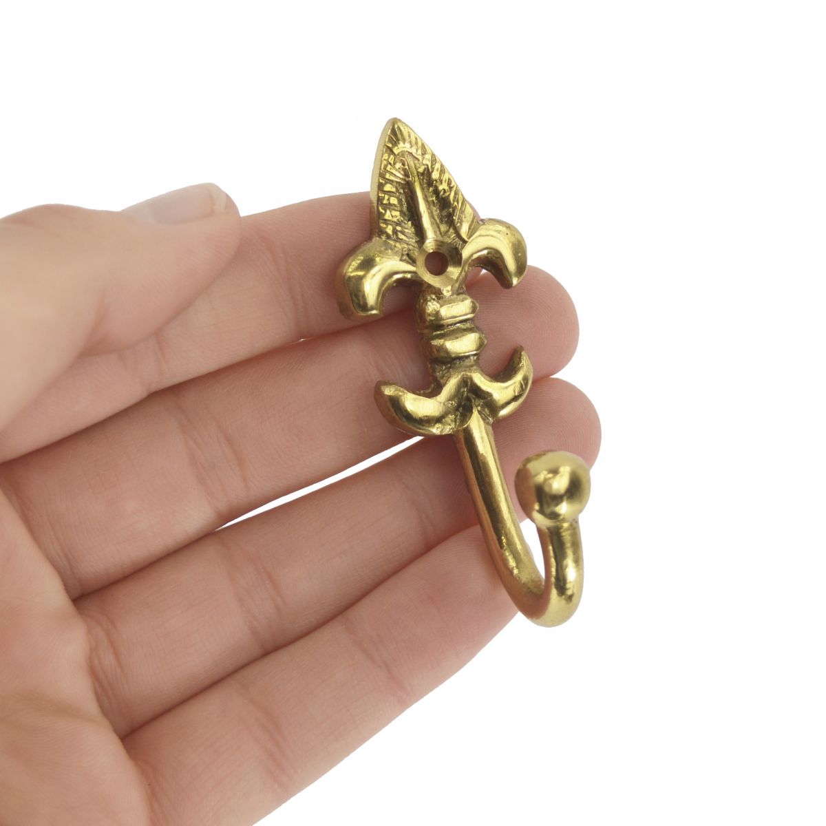 Curtain tie back hook polished brass in hand