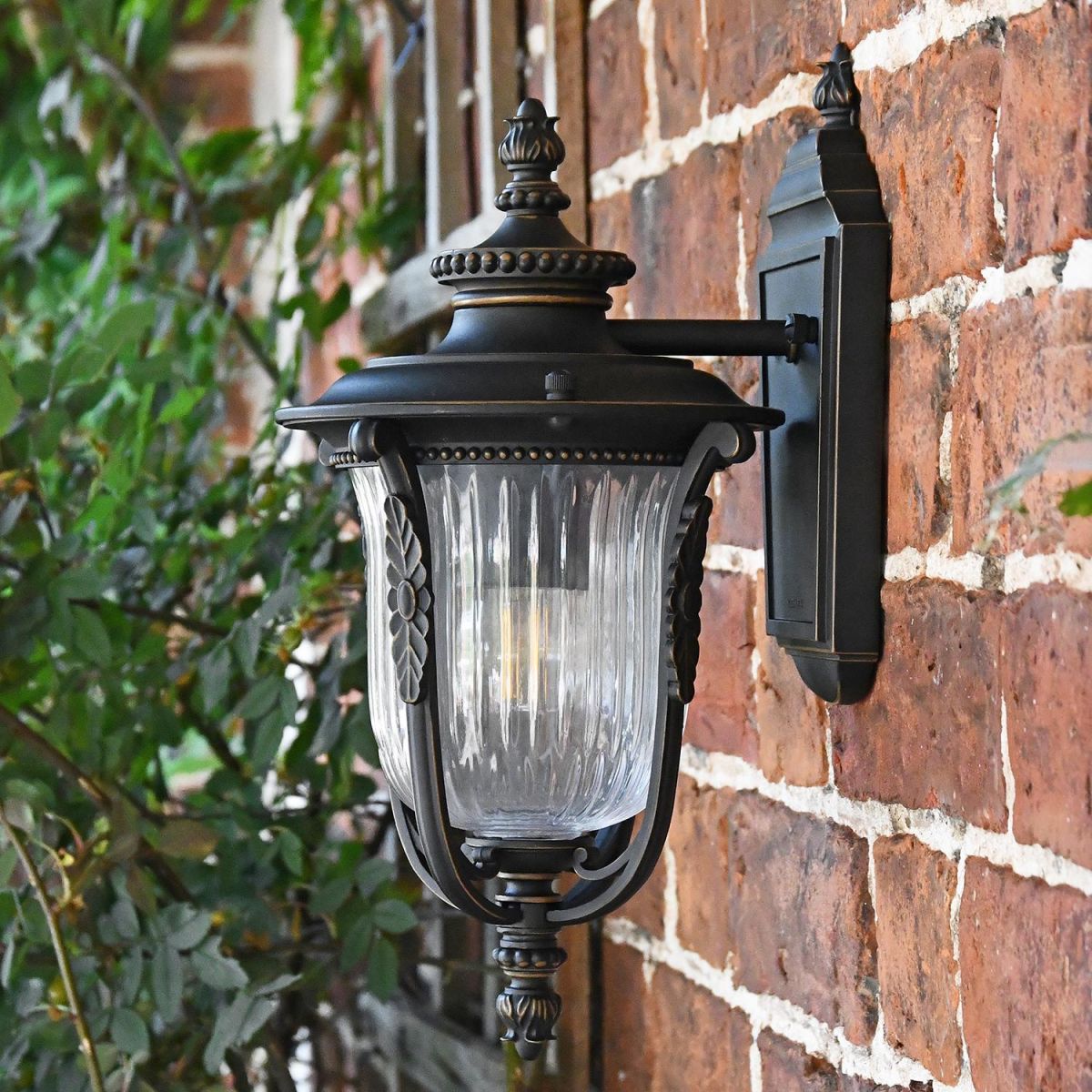 Side View of the "Christleton" Bronze Wall Mounted Porch Light Mounted on a Brick Wall