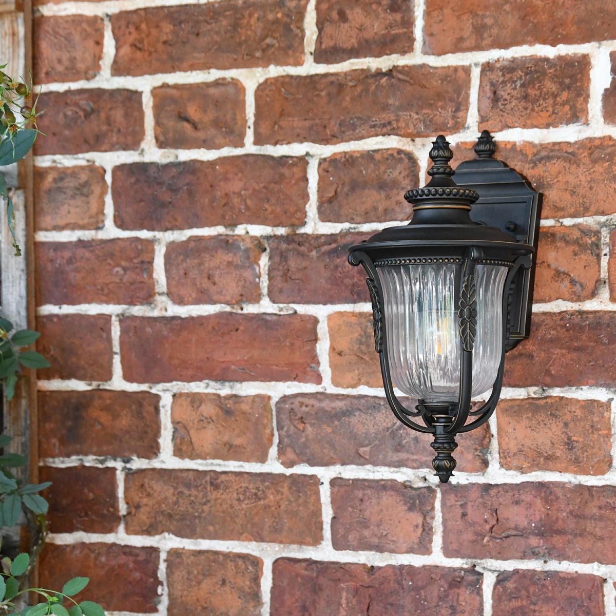 Bronze Wall Mounted Porch Light in Use on the Front of a House