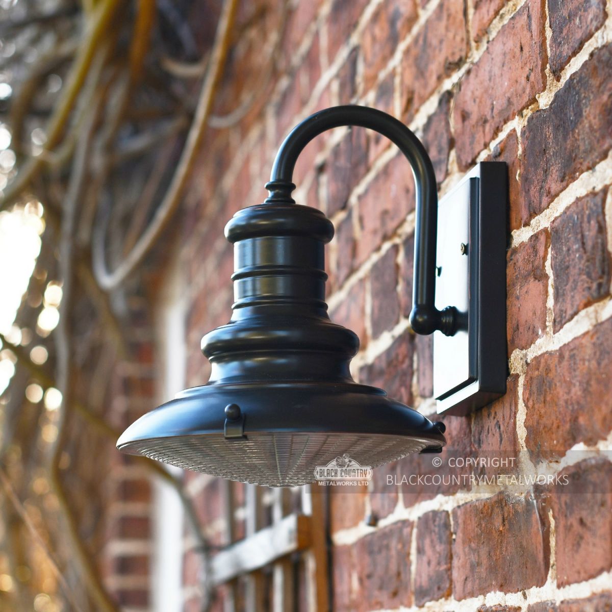 Aluminium wall mounted Station light finished in black