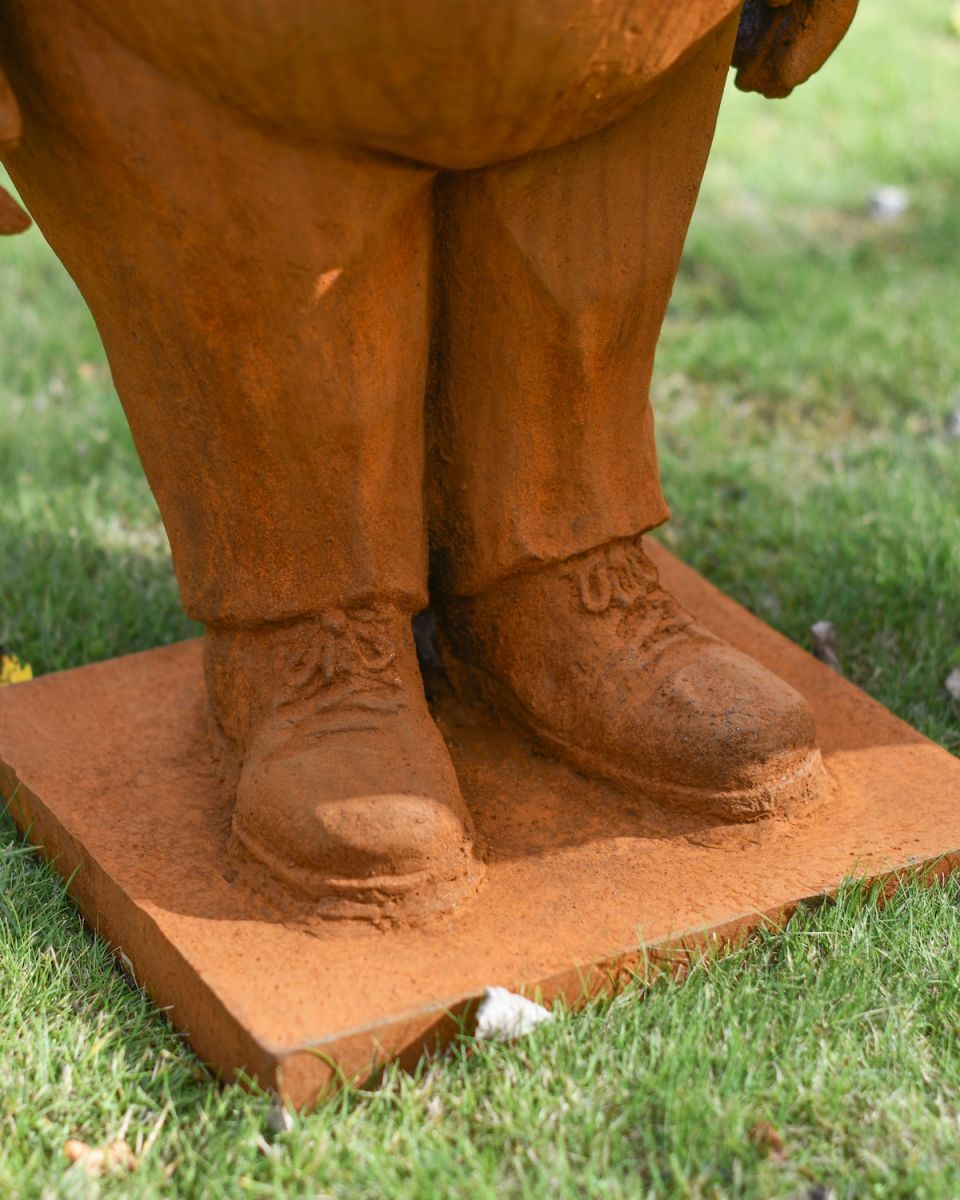 Close up of intricate shoes detail on tweedledee and tweedledum garden sculptures