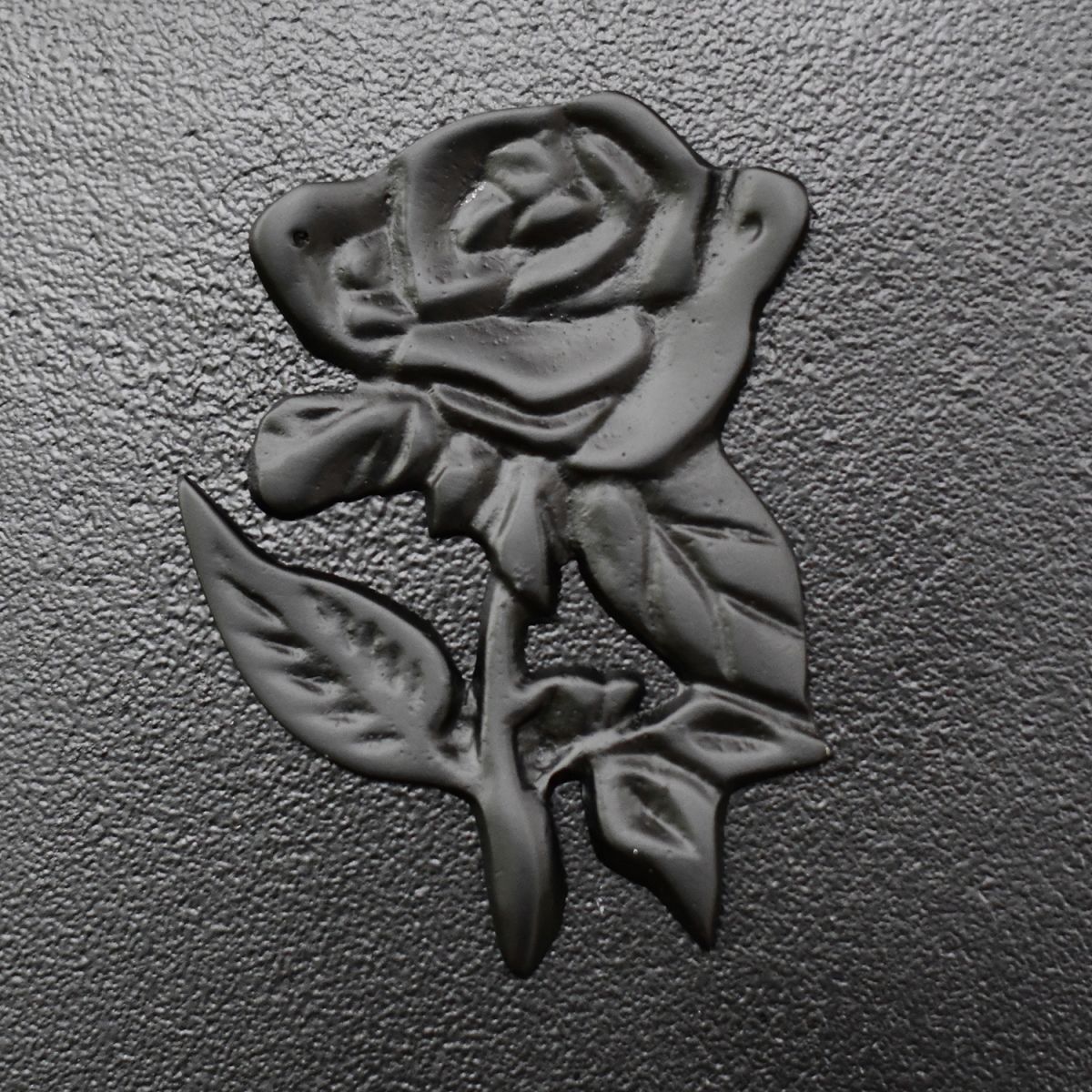 Close-up of the Black rose Motif on the Front of the Post Box