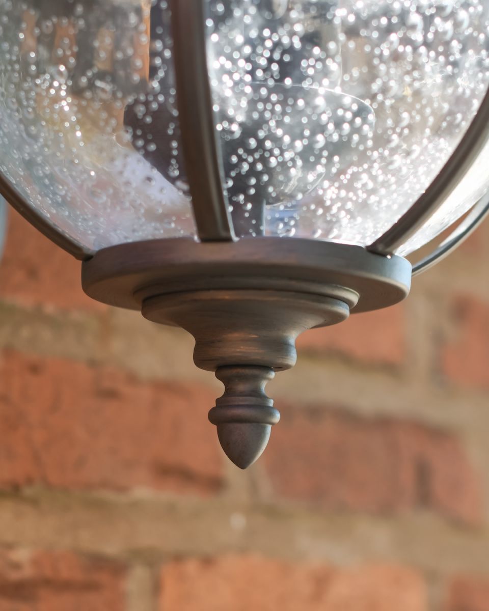 Close up of ornate detailing on outdoor wall lantern