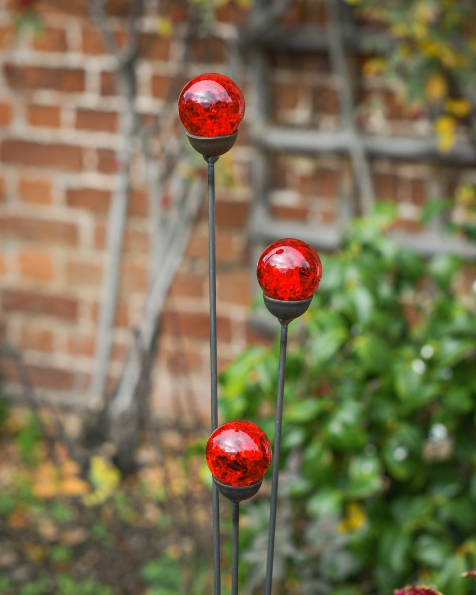 Close up of all 3 marbles on suncatcher garden ornament