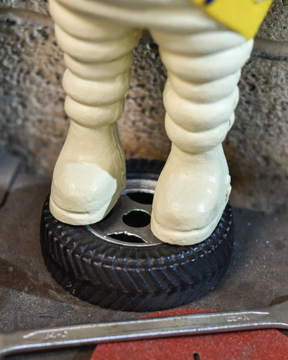 close up of base on Michelin man statue