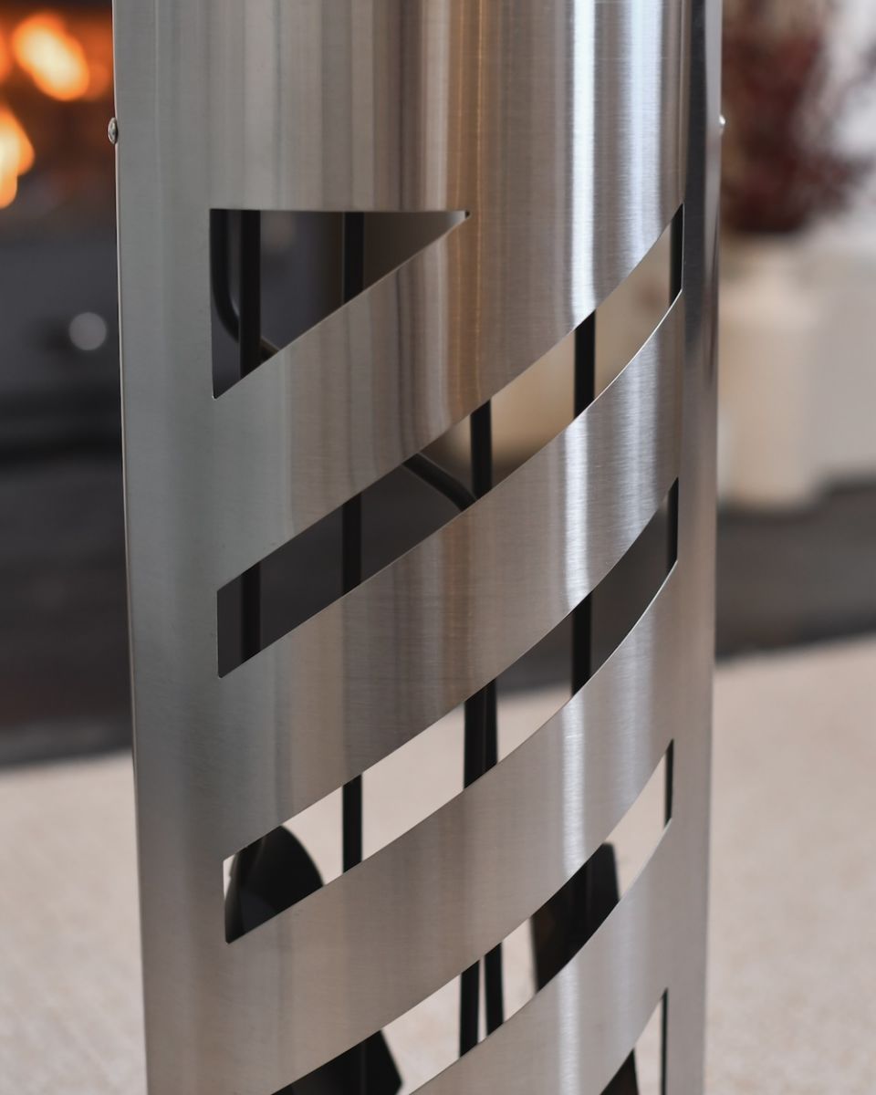 Close up of steel cut out detail on fireside companion set