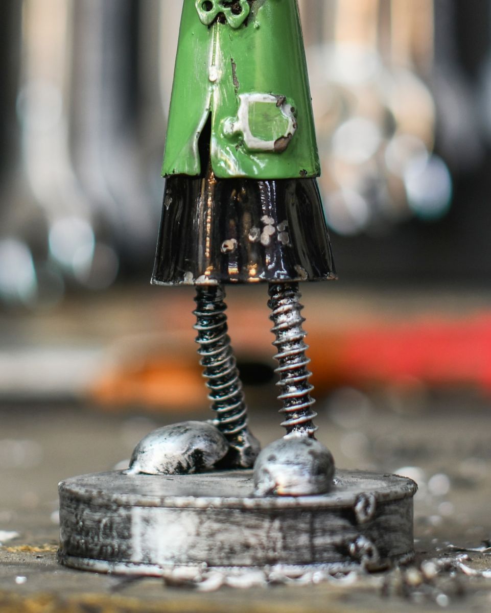 Close up of intricate body detail on scrap metal art sculpture