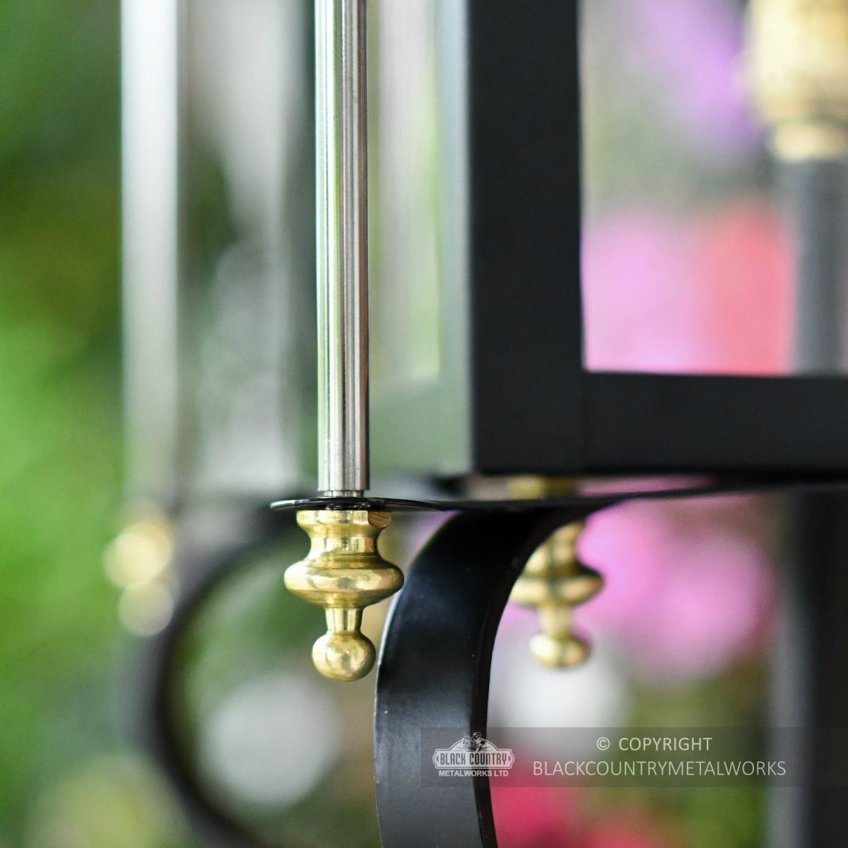Close Up Of Brass Detailing On Black Wall Light