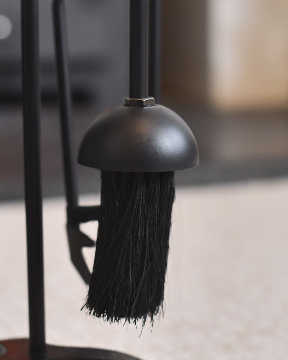 Close up of brush on fireside companion set