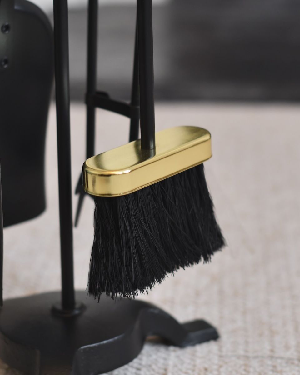 Close up of brush on fireside companion set