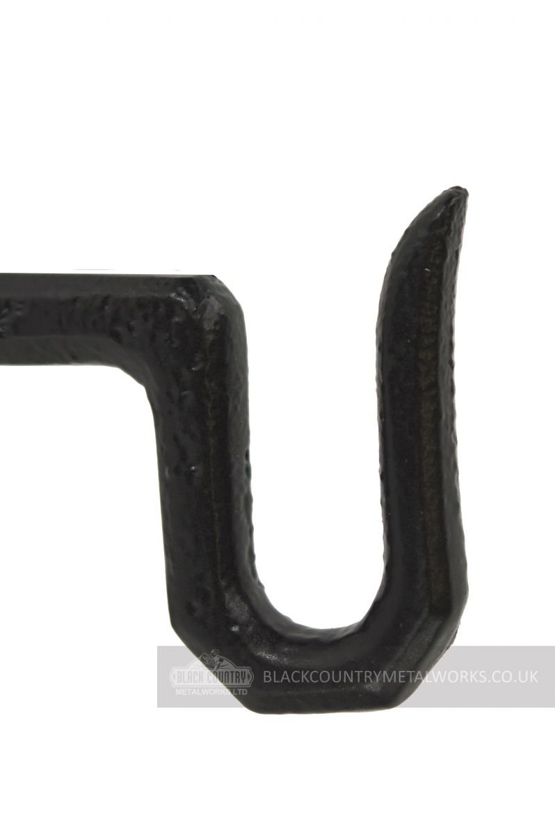 Close up detail of black cast iron hanging basket hook