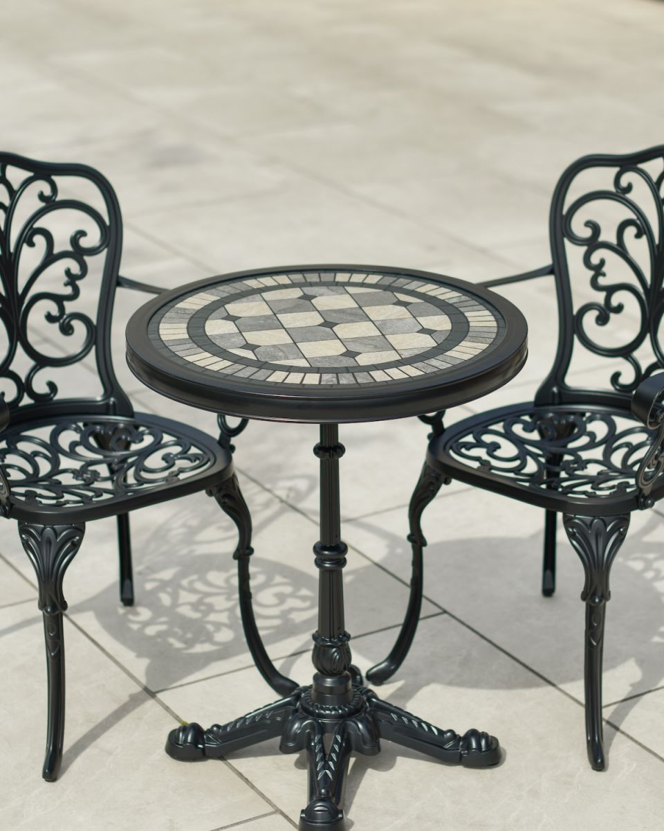 Close up of of mosaic tiled garden table and chairs set