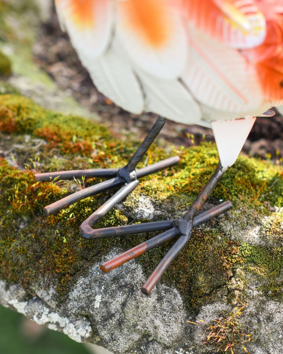 Close up of feet detail on colourful patio ornament