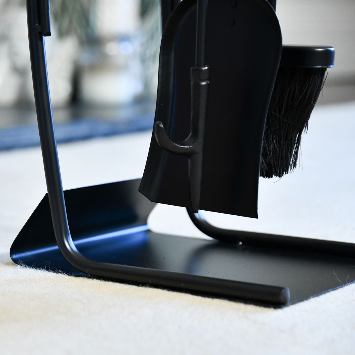 Close up of freestanding base on log burner tools