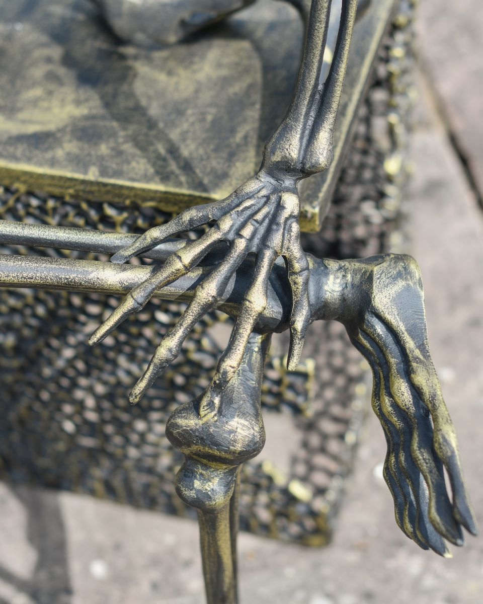 Close up of intricate hand detail on outdoor skeleton statue