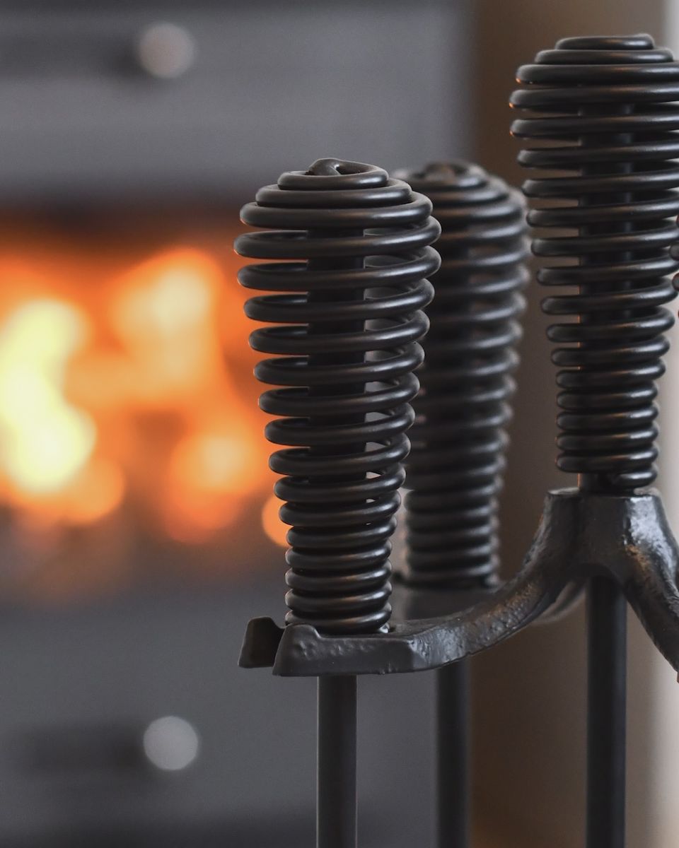 Close up of intricate handle detail on fireside companion set