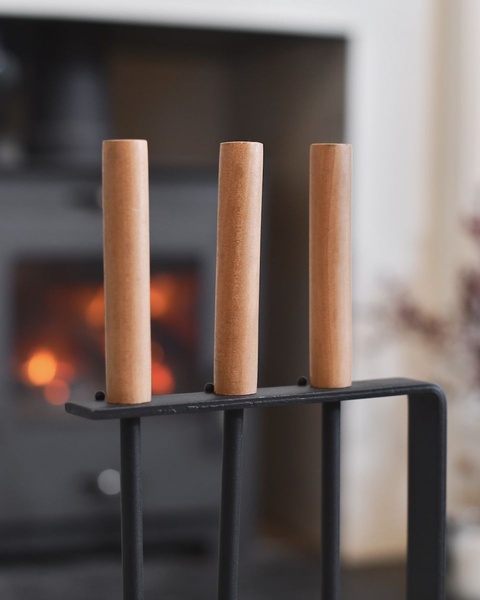 Close up of wooden handle on fireside companion set