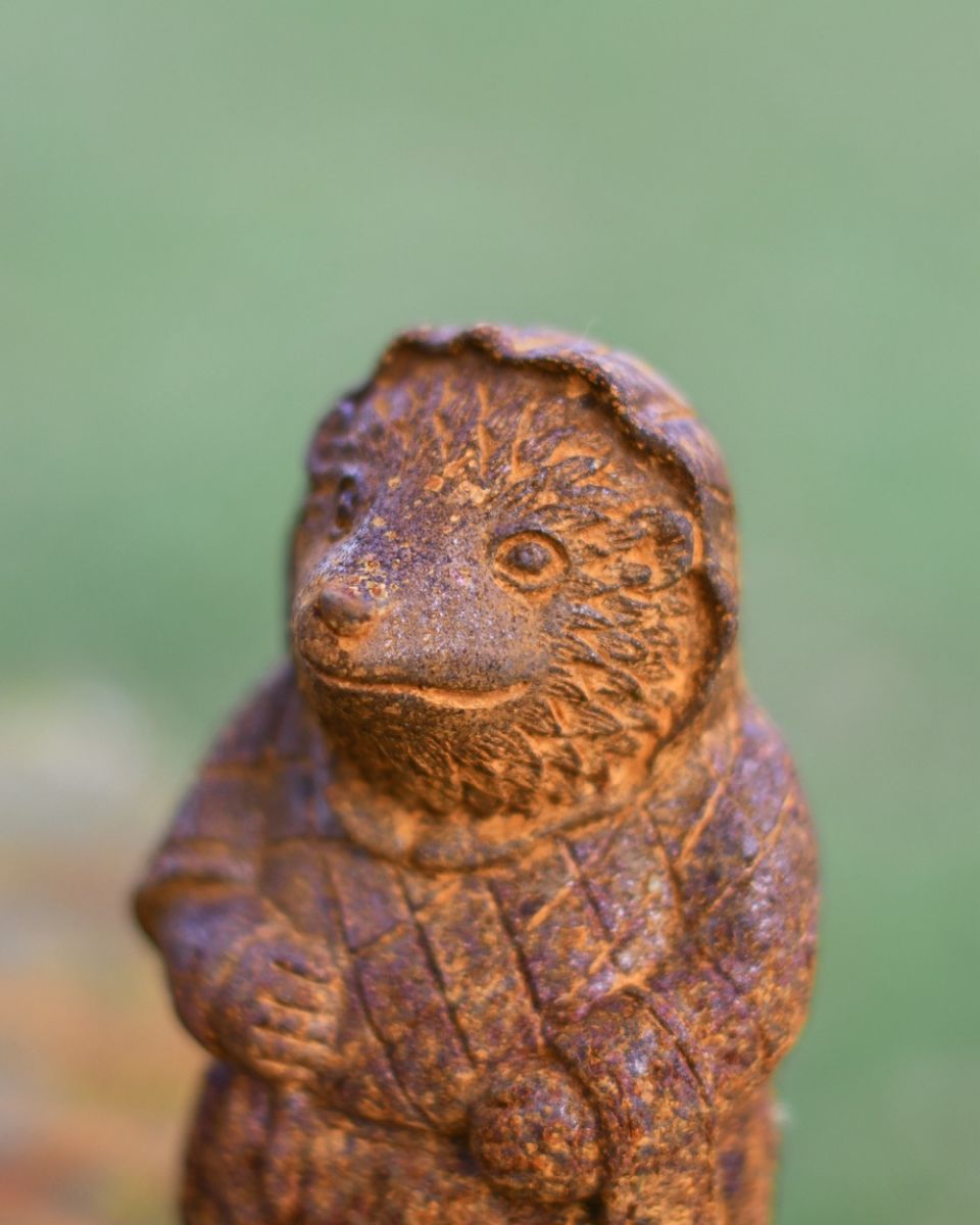 Close up of face detail on hedgehog rustic finish garden ornament