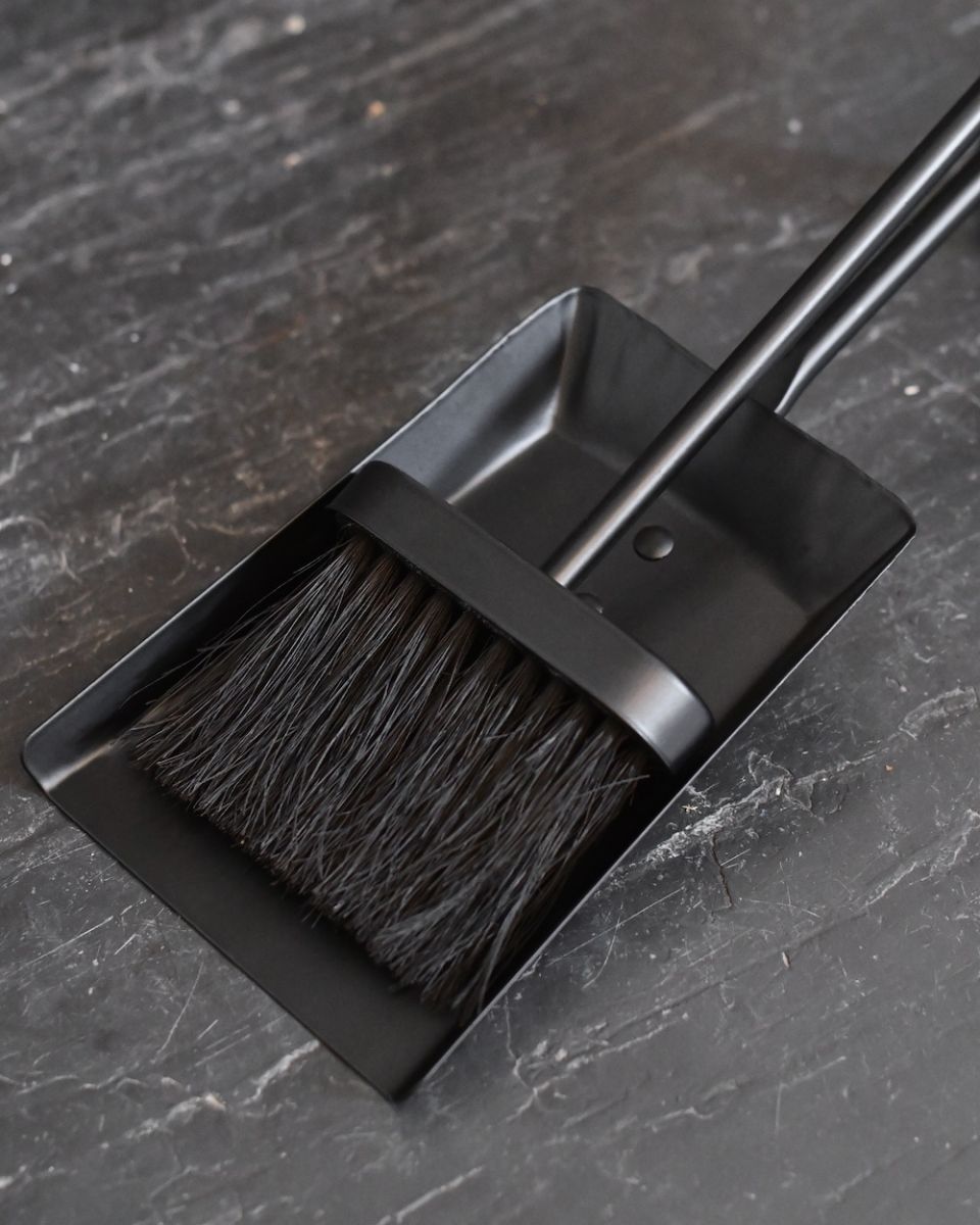 Close up of brush in fireside brush and shovel set