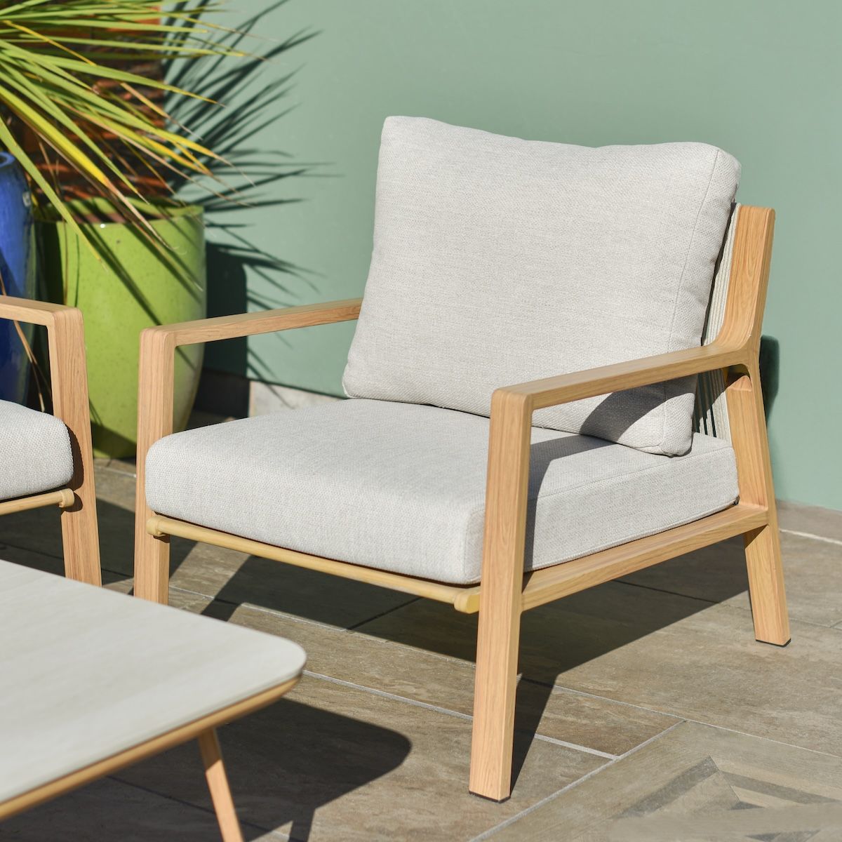 Close up of individual armchair on six piece garden lounge furniture set Close up of individual armchair on six piece garden lounge furniture set
