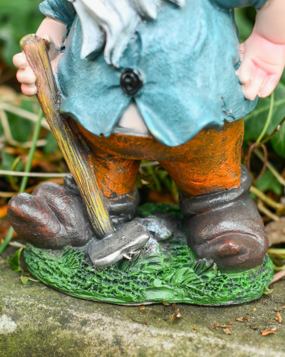 Close up of intricate detail on colourful garden gnome ornament