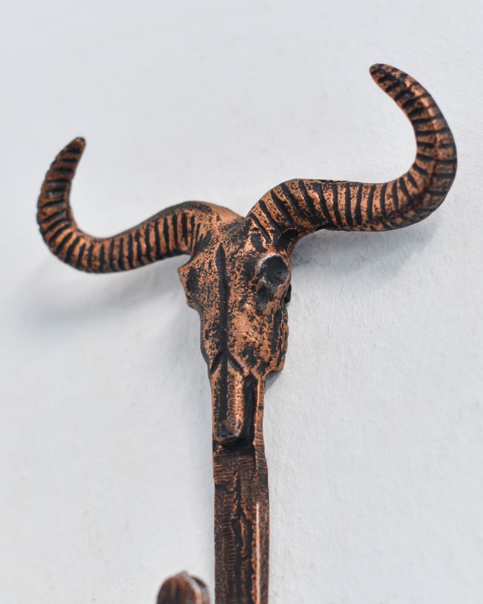 Close up of intricate skull and horn detail on Copper Longhorn Hook