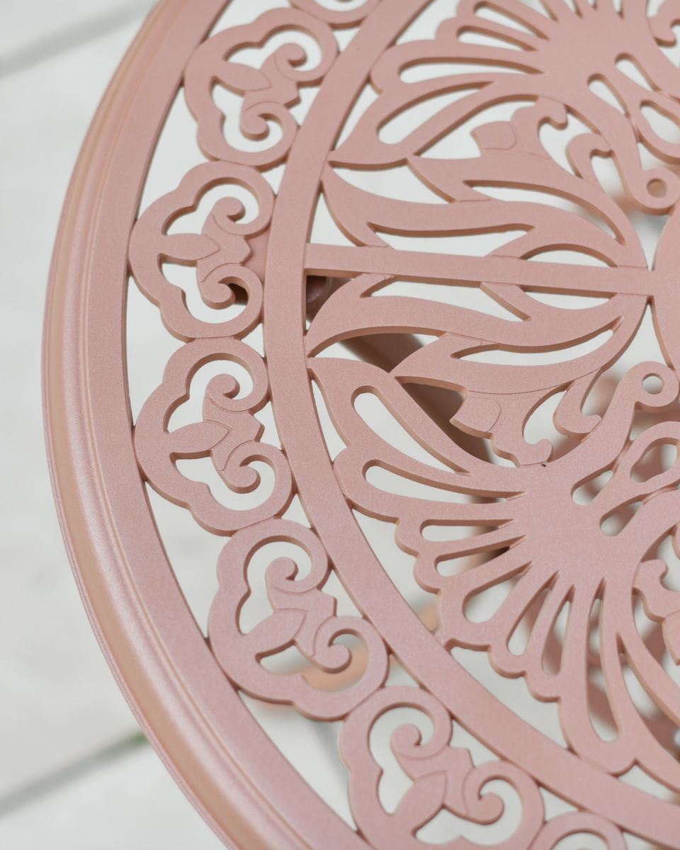 Close up of intricate table top detail on garden two seater bistro set