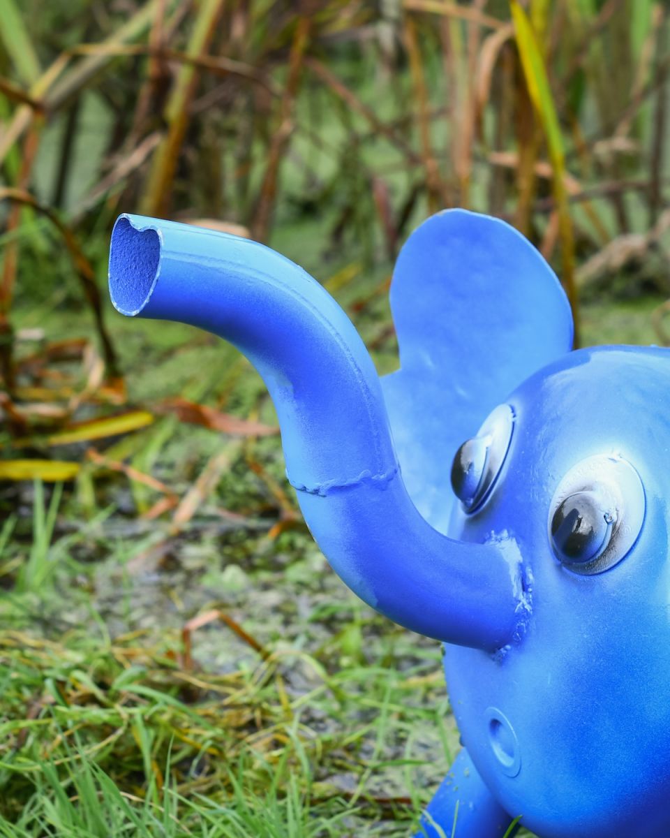 Close up of intricate trunk detail on recycled metal elephant outdoor statue