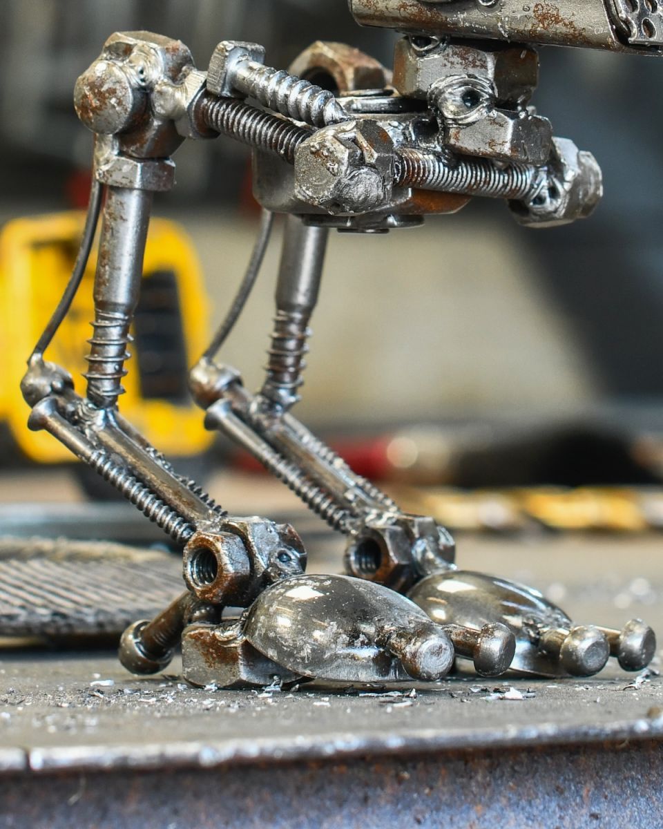 Close up of intricate leg detail on recycled metal home decor sculpture